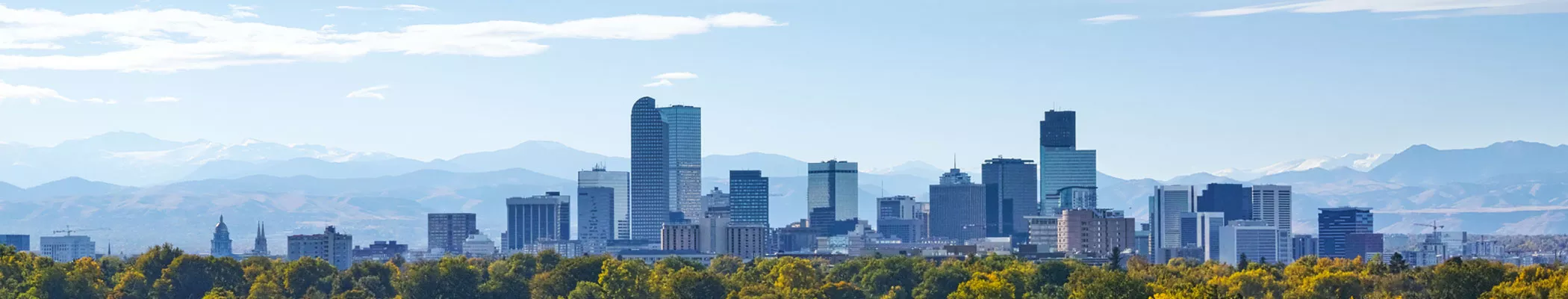 Denver city skyline on a sunny, cloudy day.
