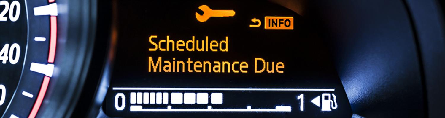 View of a vehicles dashboard with scheduled maintenance due icons